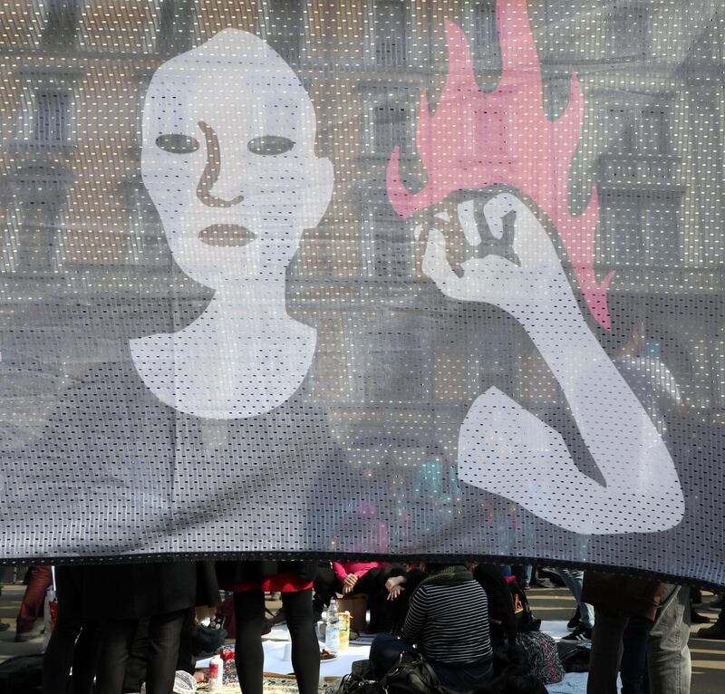 Women take part in a demonstration on the occasion of International Women's Day in Milan, northern Italy. International Women's Day, a focal point in the movement for women's rights, is celebrated on 08 March every year.  EPA