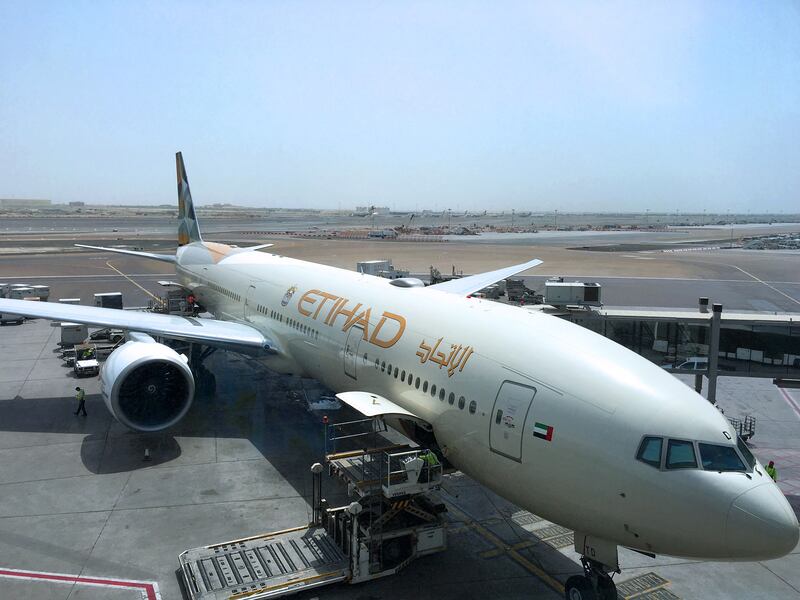 An Etihad aircraft sits on the tarmac at Abu Dhabi International Airport on Thursday, July 28, 2016. Liz Claus / The National *** Local Caption ***  LC072816-Etihad.JPG