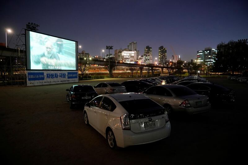 Vehicles parked at a drive-in theatre that has been temporarily made for residents to enjoy movies while keeping social distancing amid the outbreak of the coronavirus. Reuters