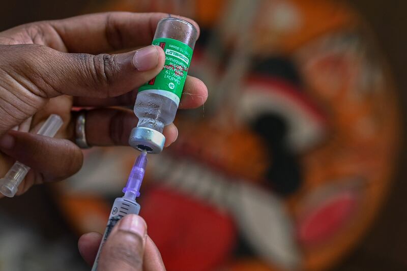 A health worker prepares to administer a Covishield vaccine in Chennai. Arun Sankar / AFP