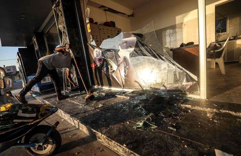 A Palestinian inspects the destruction following an Israeli airstrike in Gaza city. AFP