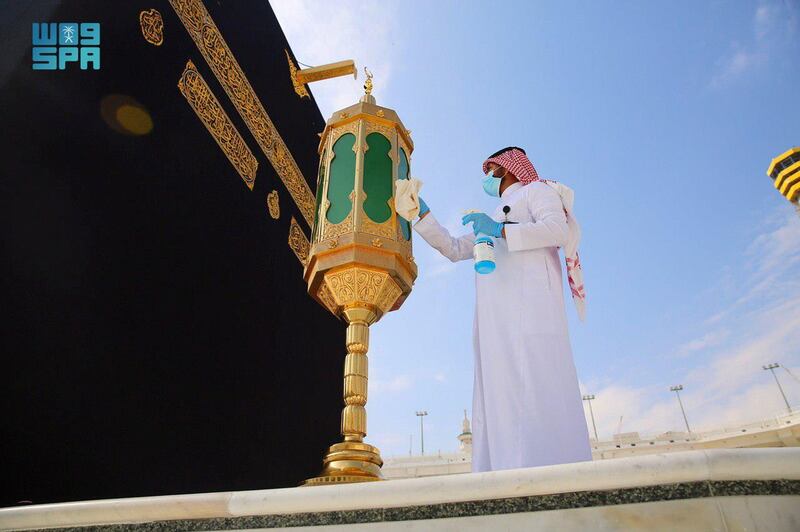 An official from the General Presidency for the Affairs of the Two Holy Mosques polishes the enclosure of Maqam Ibrahim, at the Kaaba, in the Grand Mosque, in Makkah, Saudi Arabia. Reuters