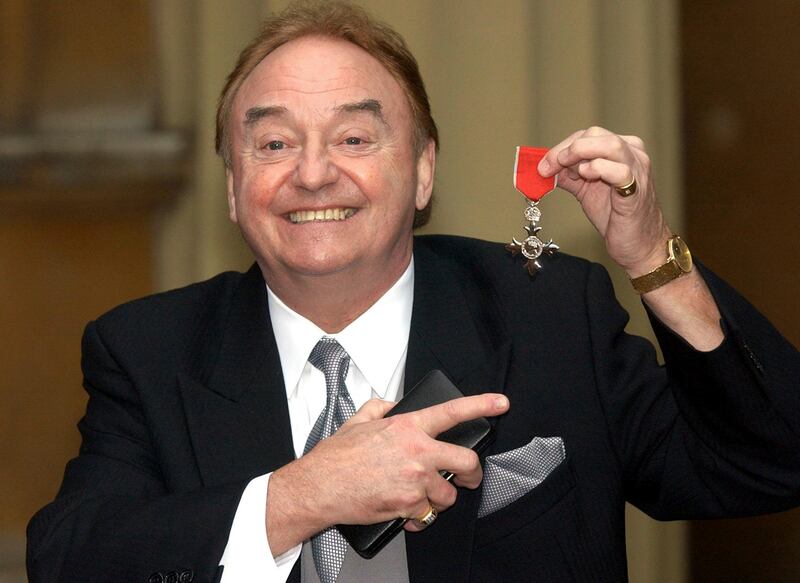 Gerry Marsden holds his MBE. AP