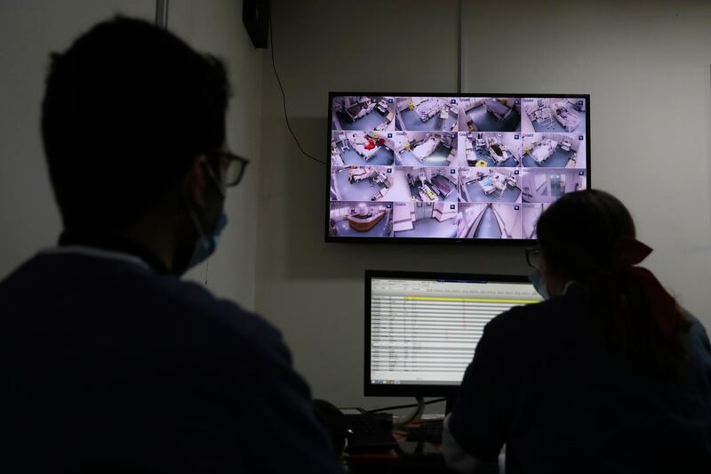 Medical staff monitor Covid-19 patients on CCTV screens in the intensive care unit of the Rafik Hariri University Hospital in Beirut, Lebanon. AP
