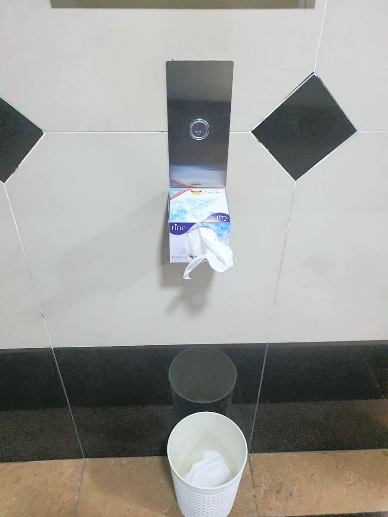 A tissue paper box stuck next to the elevator in a building in Jumeirah Village Circle, Dubai, to discourage residents from directly touching the button. Courtesy of Vikas S