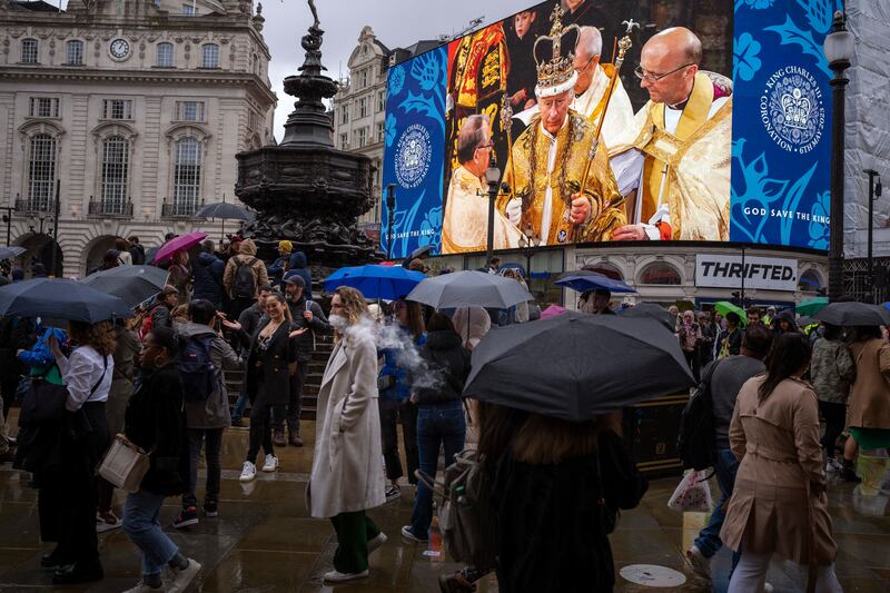A giant screen in Piccadilly Circus, central London, showing the ceremony. AP