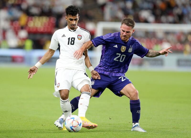 The UAE's Abdalla Ramadan is challenged by Alexis Mac Allister of Argentina