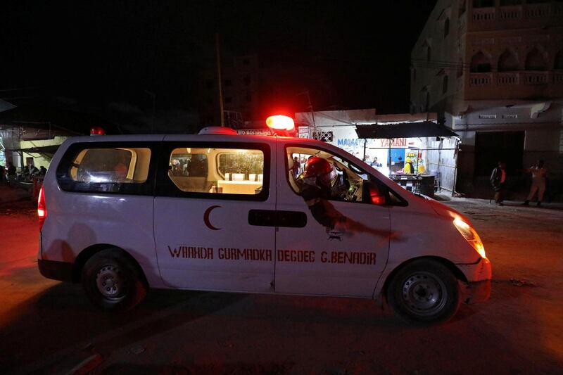 An ambulance drives from the scene of a blast at the Elite Hotel in Lido beach in Mogadishu, Somalia.  Reuters