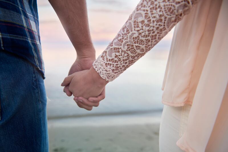 Loving couple holding hands together. (Getty Images) *** Local Caption ***  na27de-letters-marriage.jpg