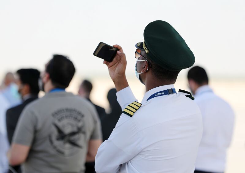 A visitor takes pictures of the Russian Knights. Chris Whiteoak / The National