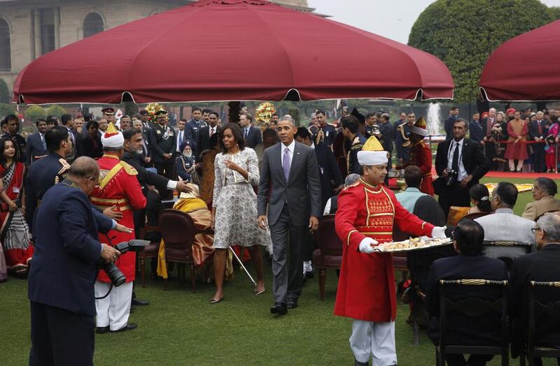 US president Barack Obama, walking with first lady Michelle Obama, during a reception hosted by Indian president Pranab Mukherjee on India’s Republic Day at the presidential palace on January 26, 2015. Manish Swarup/AP Photo