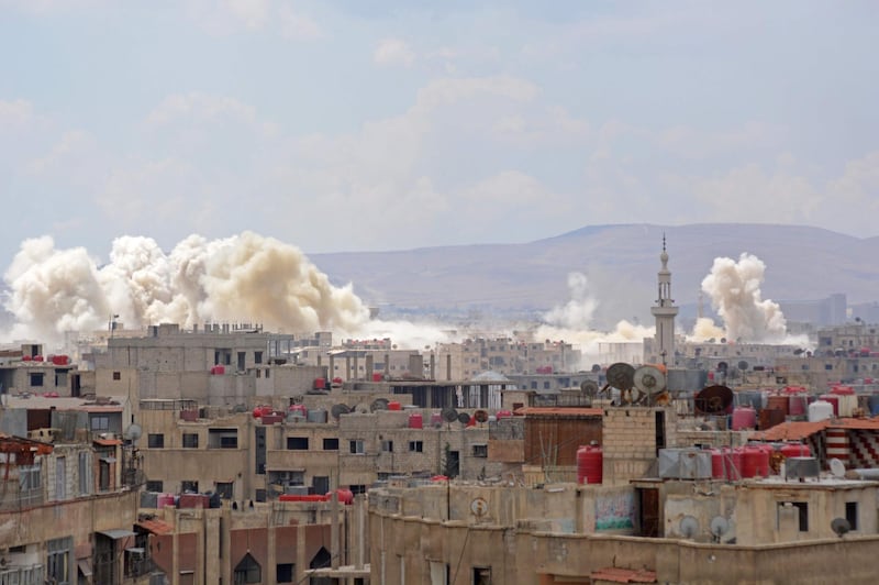Smoke billowing from the Palestinian camp of Yarmouk, south of the Syrian capital Damascus. Rami al Sayed / AFP