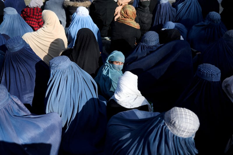 Afghan women at a Kabul market following the face-covering decree. Reuters