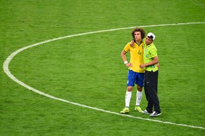 BELO HORIZONTE, BRAZIL - JULY 08:  Thiago Silva of Brazil consoles David Luiz after Germany's 7-1 victory during the 2014 FIFA World Cup Brazil Semi Final match between Brazil and Germany at Estadio Mineirao on July 8, 2014 in Belo Horizonte, Brazil.  (Photo by Jamie McDonald/Getty Images)