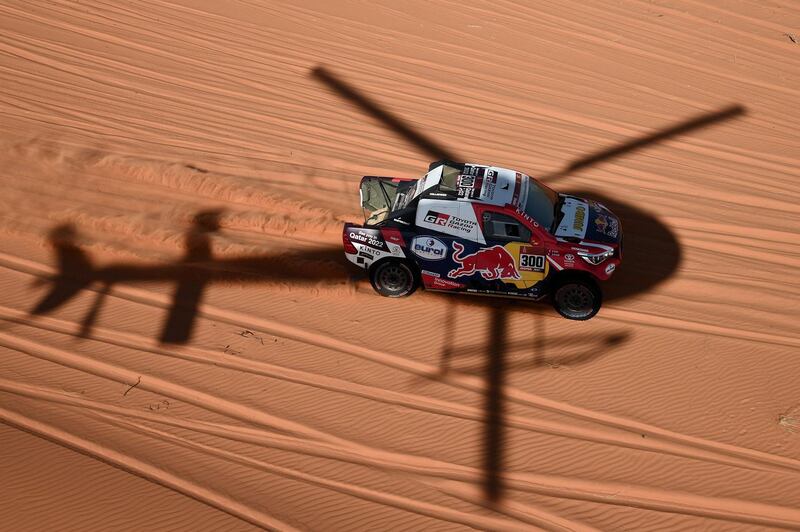 Toyota's driver Nasser Al-Attiyah of Qatar (R) and his co-driver Mathieu Baumel of France competes during the Stage 6 of the Dakar 2020 between Ha'il and Riyadh, Saudi Arabia. AFP