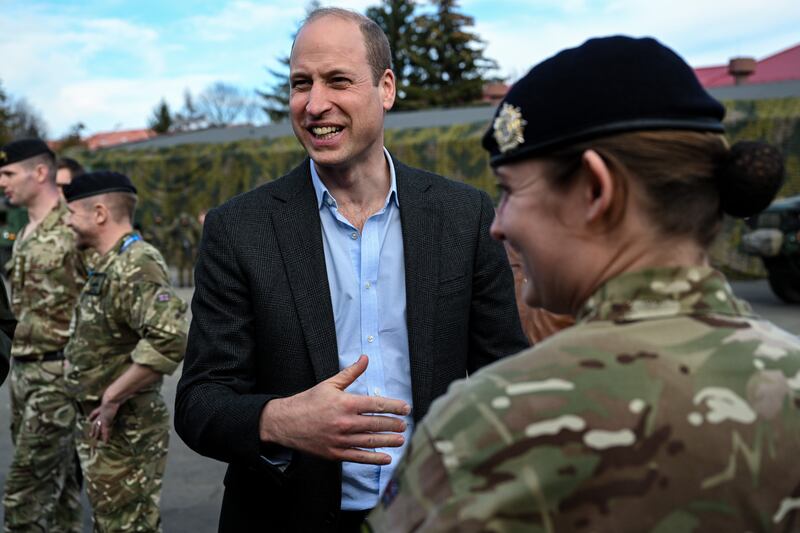 Britain's Prince William speaks with Polish and British soldiers in Rzeszow. EPA