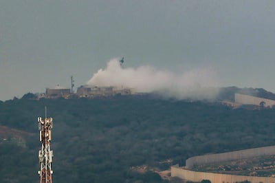 Smoke billows from a Israeli army post on the border with Lebanon after it was hit by rocket fire. AFP