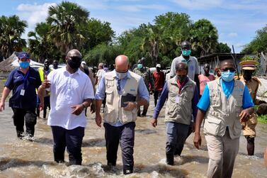 Alain Noudehou, UN Humanitarian Co-ordinator in South Sudan, and Matthew HollingWorth, the Country Director of World Food Programme, visit a flooded area in Duk Padiet county of Jonglei state in South Sudan on September 24, 2020. Reuters