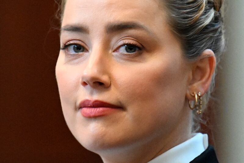 Amber Heard listens in the courtroom. AP