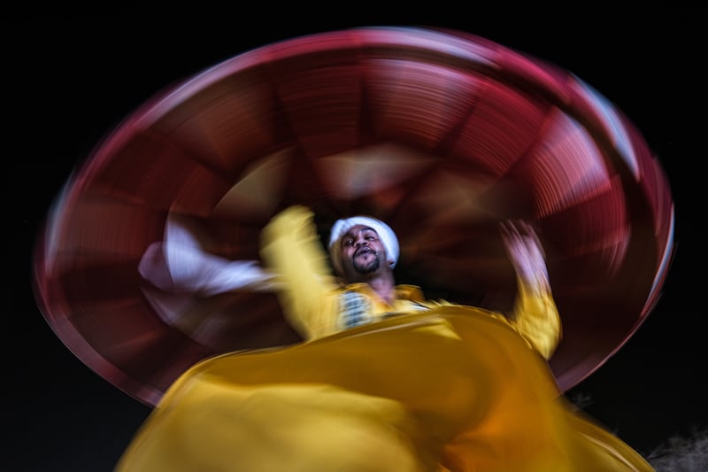 An Egyptian traditional dancer performs the Tanoura dance during a street performance in Sharm El Sheikh. EPA