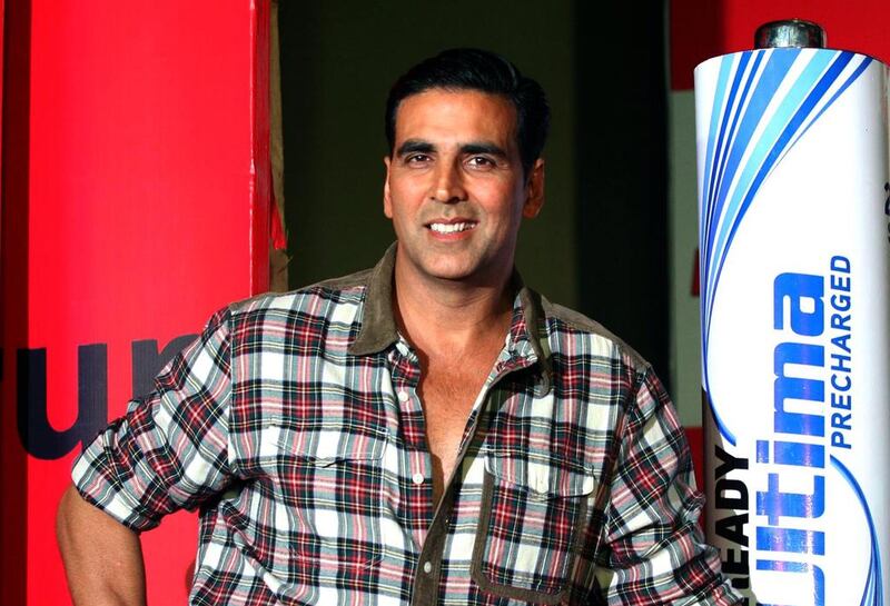 Indian Bollywood actor Akshay Kumar, brand ambassador for power product company Eveready poses during a launch ceremony in Mumbai late June 6, 2013.  AFP PHOTO/STR