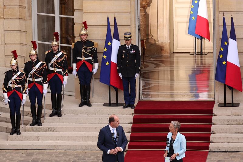 Mr Castex delivers a speech next to Ms Borne during the ceremony. AFP