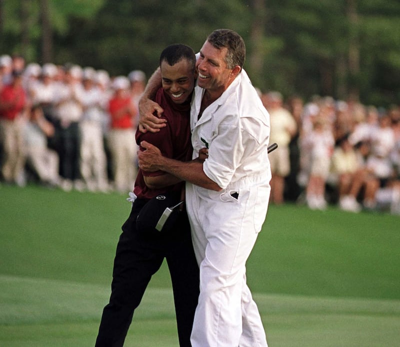 8 Apr 2001:  Tiger Woods of the USA celebrates with his caddie Steve Williams after winning the Masters on the 18th green during the final day of the 2001 Masters at the Augusta National Golf Club, Augusta, GA, USA. Mandatory Credit: Stephen Munday/ALLSPORT/Getty Images