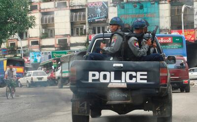 FILE PHOTO: A police vehicle patrols the road in Yangon August 11, 2009, where judgement on major opposition leader Aung San Suu Kyi was passed.   To match Special Report MYANMAR-REPORTERS/DEMOCRACY        REUTERS/Aung Hla Tun/File Photo