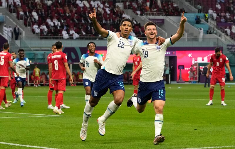 Jude Bellingham celebrates with Mason Mount after scoring England's opening goal in the 6-2 victory against Iran at the Khalifa International Stadium in Doha on November 21, 2022. AP