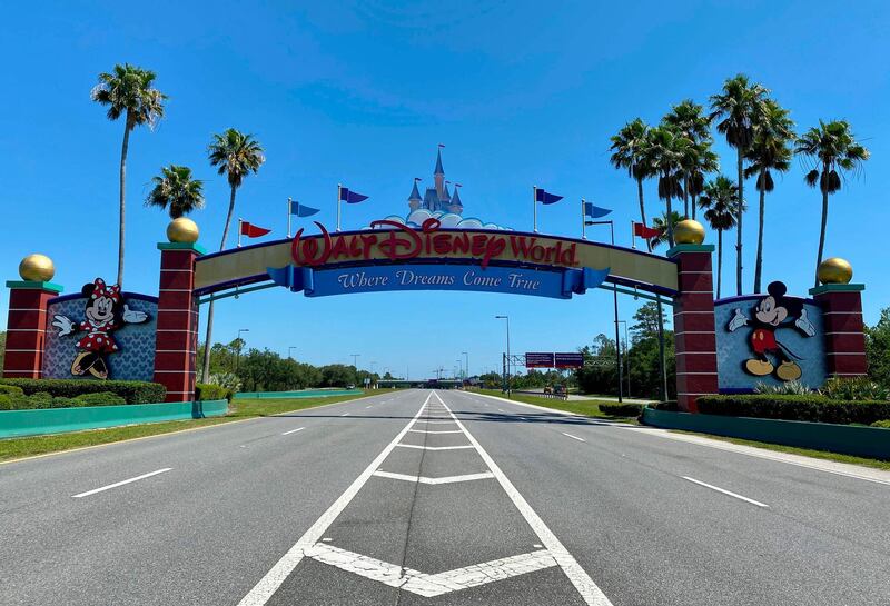 An empty road leads into a deserted Disney resort after it was closed due to the COVID-19 pandemic in Kissimmee, Florida on May 5, 2020.   / AFP / Daniel SLIM

