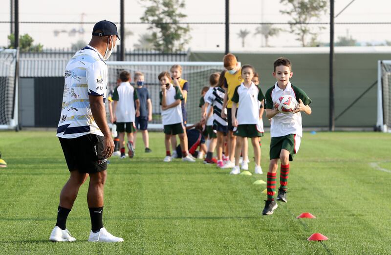 Osea Kolinisau and his Speranza 22 teammates lead a training session for young rugby players in Dubai.
