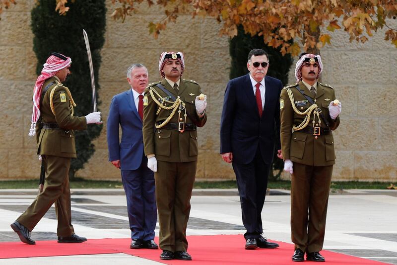 Jordan's King Abdullah II and Fayez al-Sarraj, Libya's Prime Minister, review Bedouin honour guards at the Royal Palace in Amman, Jordan. Reuters