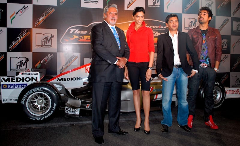 epa01630828 Vijay Mallya (L), chairman, Force India Formula One Team, Deepika Padukone (2-L), bollywood actress, and brand ambassador, Kingfisher Airlines, Ashish Patil (2-R), General Manager, and Senior Vice President creative and content, MTV India, and Rannvijay, MTV video jockey pose for a photograph during an event to annouce of Vijay Mallya's Force India Formula One Team in partnership with MTV for a reality show 'MTV Force India...The Fast and the Gorgeous!' in Mumbai, India, 10 February 2009. Through the auditions, 20 girls will be shortlisted who will partake in the reality series at the end of which 4 girls will be choosen as the speed divas for the Force India Team, and will travel with the Force India team to the Formula One Grand Prix's around the world besides also being featured on the Force India Calender. The final winner gets a plum role in the next film by Percep Picture Company. Formula One Racing, one of the most expensive and popular sports inthe world is set to explode in India, as the first Indian Grand Prix in 2011 will be hosted by India.  EPA/STR