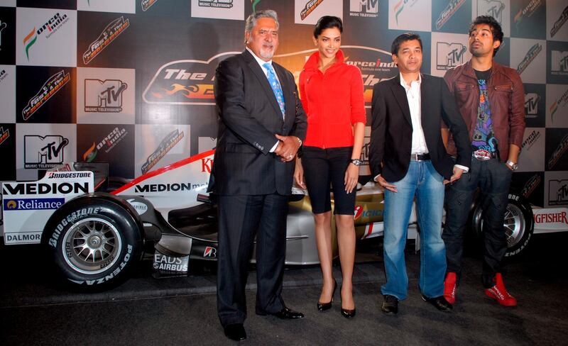 epa01630828 Vijay Mallya (L), chairman, Force India Formula One Team, Deepika Padukone (2-L), bollywood actress, and brand ambassador, Kingfisher Airlines, Ashish Patil (2-R), General Manager, and Senior Vice President creative and content, MTV India, and Rannvijay, MTV video jockey pose for a photograph during an event to annouce of Vijay Mallya's Force India Formula One Team in partnership with MTV for a reality show 'MTV Force India...The Fast and the Gorgeous!' in Mumbai, India, 10 February 2009. Through the auditions, 20 girls will be shortlisted who will partake in the reality series at the end of which 4 girls will be choosen as the speed divas for the Force India Team, and will travel with the Force India team to the Formula One Grand Prix's around the world besides also being featured on the Force India Calender. The final winner gets a plum role in the next film by Percep Picture Company. Formula One Racing, one of the most expensive and popular sports inthe world is set to explode in India, as the first Indian Grand Prix in 2011 will be hosted by India.  EPA/STR