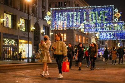 Pedestrians pass festive lights on Oxford Street in London, U.K., on Tuesday, Nov. 17, 2020. With a partial lockdown in England closing all non-essential stores until at least Dec. 2, rescuing the next six weeks from Covid-19 is critical for the U.K.'s financial well-being and a government beset by accusations that it can't get a grip on the pandemic. Photographer: Simon Dawson/Bloomberg