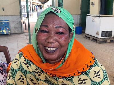 This August 18, 2019 photo shows Basmat Adam, 41, who is one of the thousands of women who sell tea on the sidewalks of Khartoum, Sudan’s capital, and are fondly known as the “tea ladies.” Mrs Adam is a native of Wad Madani in central Sudan. Photo by Hamza Hendawi for The National