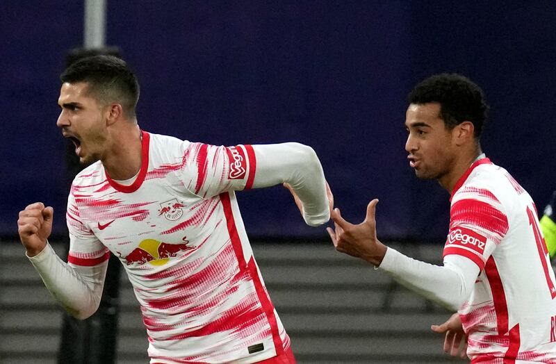 Leipzig's Andre Silva, left, celebrates with Tyler Adams after scoring his side's second goal. AP