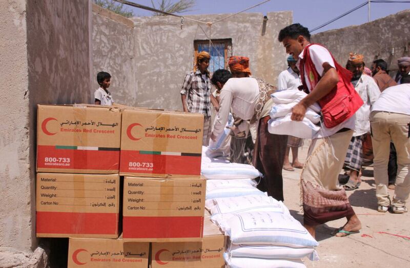 The Emirates Red Crescent Authority workers distribute aid in Yemen. WAM 