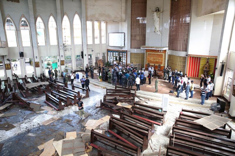 epa07328509 A handout photo made available by the Presidential Photographers Division (PPD) shows a damaged church inspected by Philippine President Rodrigo Duterte in Jolo, Sulu province, southern Philippines, 28 January 2019 (issued 29 January 2019). At least 20 people were killed and over 80 others were injured in twin bombings during a Sunday mass at Jolo Cathedral in Mindanao region of the southern Philippines on 27 January, officials said.  EPA/ALBERT ALCAIN / PPD/ HANDOUT EDITORIAL USE ONLY/NO SALES HANDOUT EDITORIAL USE ONLY/NO SALES