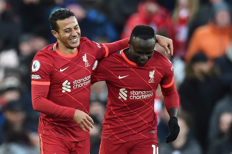 Thiago Alcantara, left, celebrates with teammate Sadio Mane after scoring Liverpool's third goal in their 4-0 win against Southampton at Anfield on Saturday, November 27. EPA