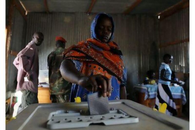 A south Sudanese women casts her vote for the referendum on the independence at a polling station in Juba, southern Sudan yesterday.