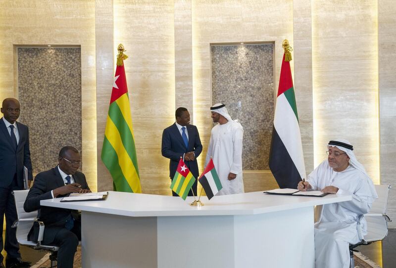 ABU DHABI, UNITED ARAB EMIRATES - March 11, 2019: HH Sheikh Mohamed bin Zayed Al Nahyan, Crown Prince of Abu Dhabi and Deputy Supreme Commander of the UAE Armed Forces (back R), and Faure Gnassingbé, Presdient of Togo (back L), witness a signing ceremony between the Khalifa Fund and Togo's Ministry of Finance to fund small and medium-sized enterprise in Togo worth AED 55 million. Seen signing (R), HE Hussain Al Nowais, Chairman of the Khalifa Fund to Support and Develop Small & Medium Enterprises, at Al Shati Palace.

( Mohamed Al Hammadi / Ministry of Presidential Affairs )
---