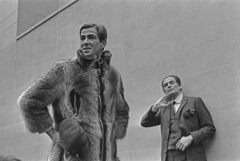 Italian-born French fashion designer Pierre Cardin (right) with his new collection, February 1966. (Photo by Reg Lancaster/Express/Hulton Archive/Getty Images)