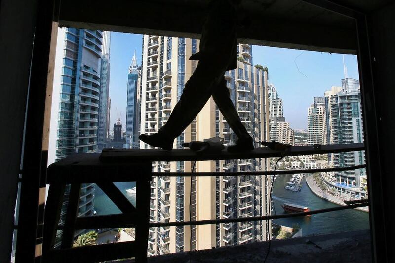 Dubai property prices will continue to fall by 3 to 5 per cent next year, according to Cluttons’ outlook for the Dubai property market for 2016. Kamran Jebreili / AP Photo