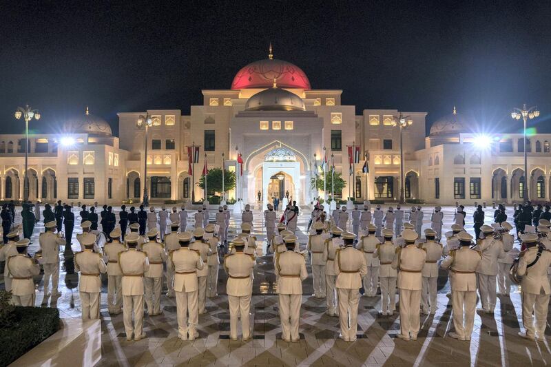 ABU DHABI, UNITED ARAB EMIRATES -October 29, 2018: HH Sheikh Mohamed bin Zayed Al Nahyan, Crown Prince of Abu Dhabi and Deputy Supreme Commander of the UAE Armed Forces ( centre R) and HE Wang Qishan, Vice President of China (centre L), stand for the national anthem, during a reception held at the Presidential Palace. 
( Hamad Al Mansouri for Crown Prince Court - Abu Dhabi )

---