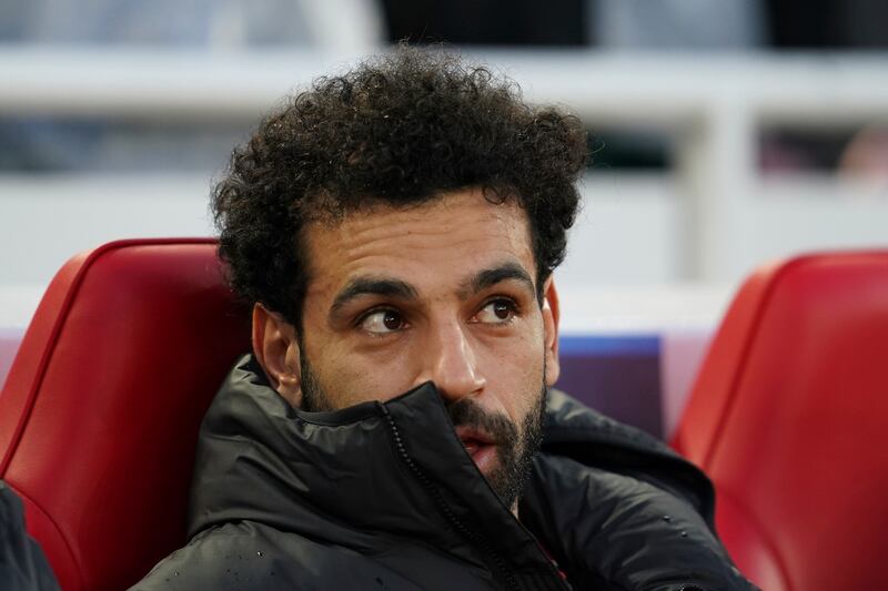 Liverpool's Mohamed Salah sits on the bench before the Champions League quarter-final against Benfica at Anfield. AP