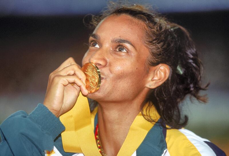 1998:  Nova Peris Kneebone of Australia kisses her Gold Medal after winning the Women's 200 metres event  during the Commonwealth games held in Kuala Lumpur, Malaysia. Mandatory Credit: Allsport Australia/ALLSPORT