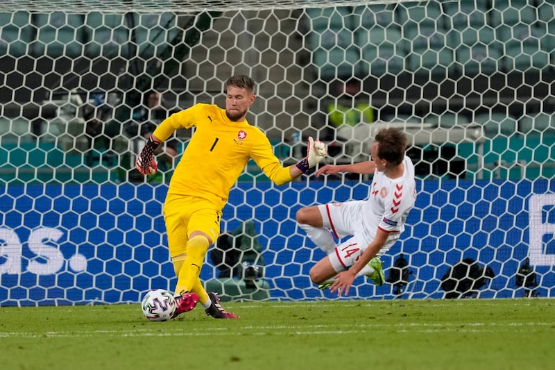 Czech Republic's goalkeeper Tomas Vaclik clears the ball away from Denmark's Mikkel Damsgaard.
