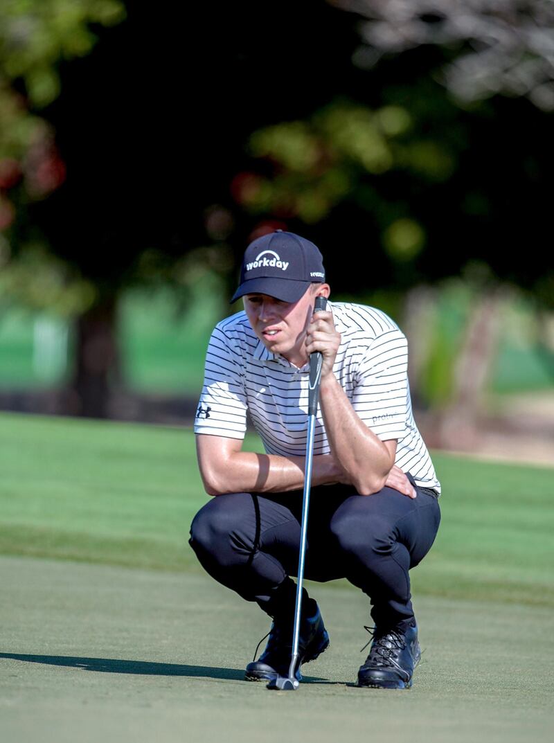 Abu Dhabi, United Arab Emirates, January 17, 2020.  2020 Abu Dhabi HSBC Championship.  Round 2.
Matthew Fitzpatrick studies the curves of the green on the first hole.
Victor Besa / The National
Section:  SP
Reporter:  Paul Radley and John McAuley