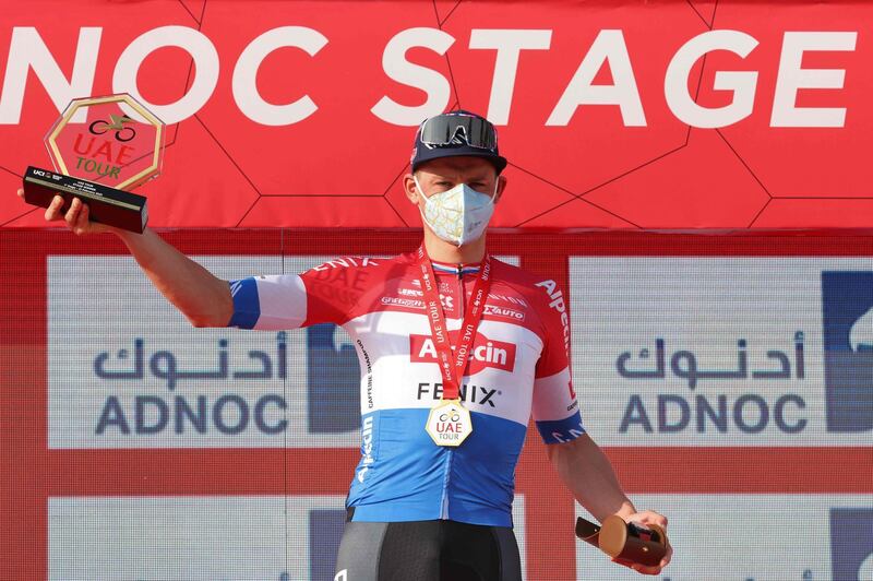 Dutch cyclist Mathieu van der Poel of Team Alpecin–Fenix celebrates on the podium after winning the first stage of the UAE Cycling Tour from al-Dhafra Castle to al-Mirfa on February 21, 2021.  / AFP / Giuseppe CACACE
